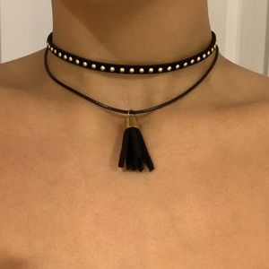 Black tassel choker with gold colored accents